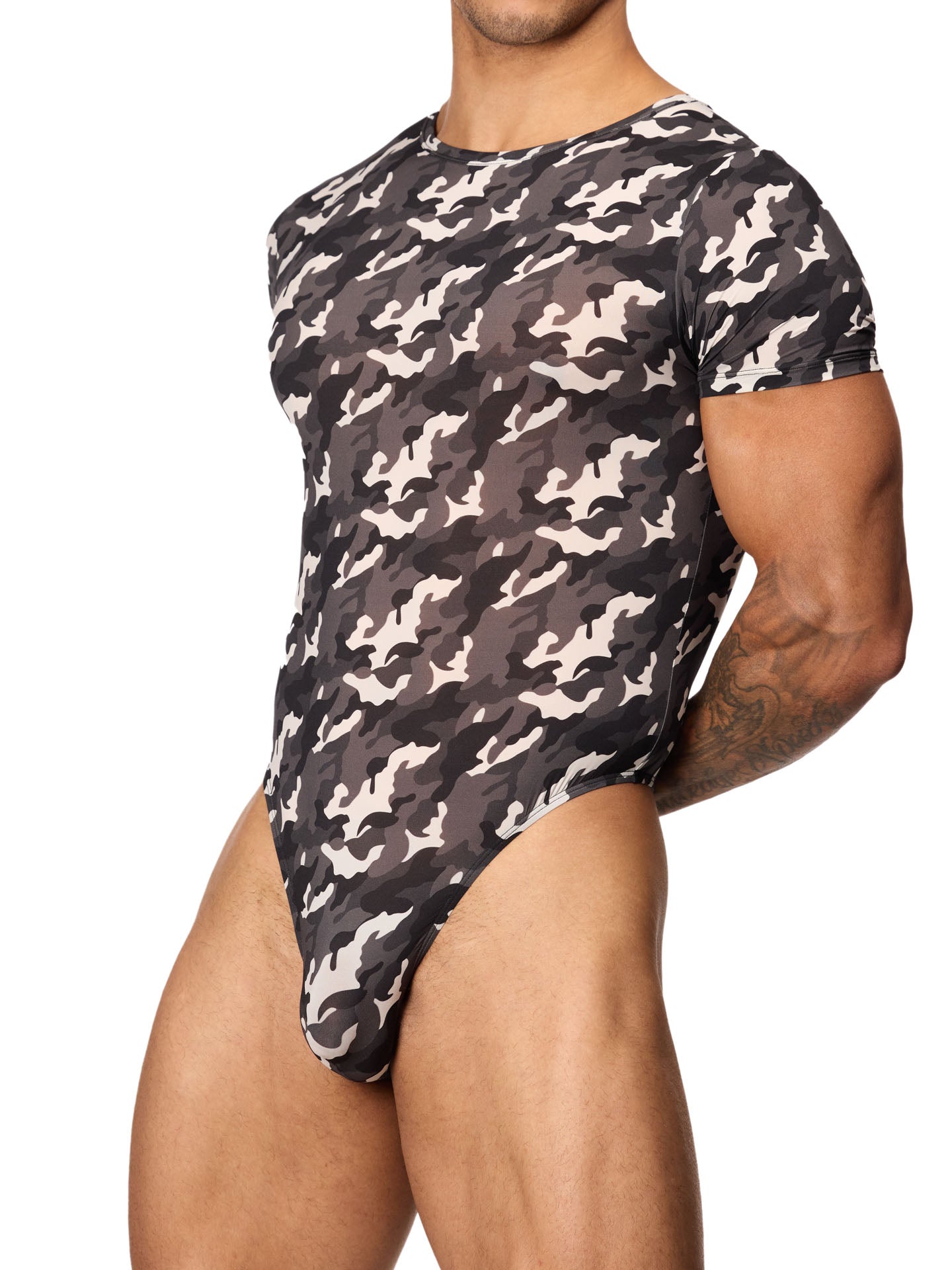 Front side view of a male model wearing a black and white camouflage bodysuit with short-sleeves