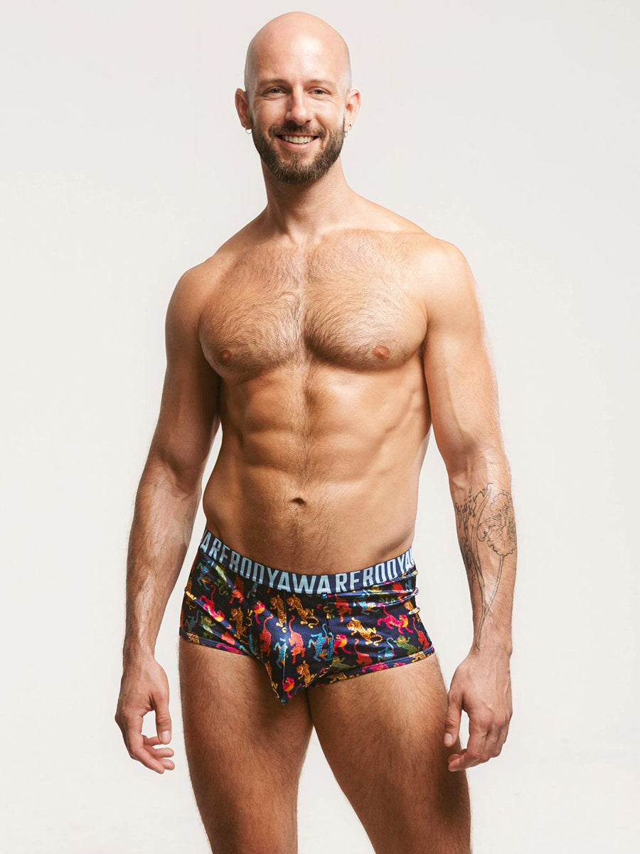 Man wearing navy blue satin boxers with a Body Aware branded waistband