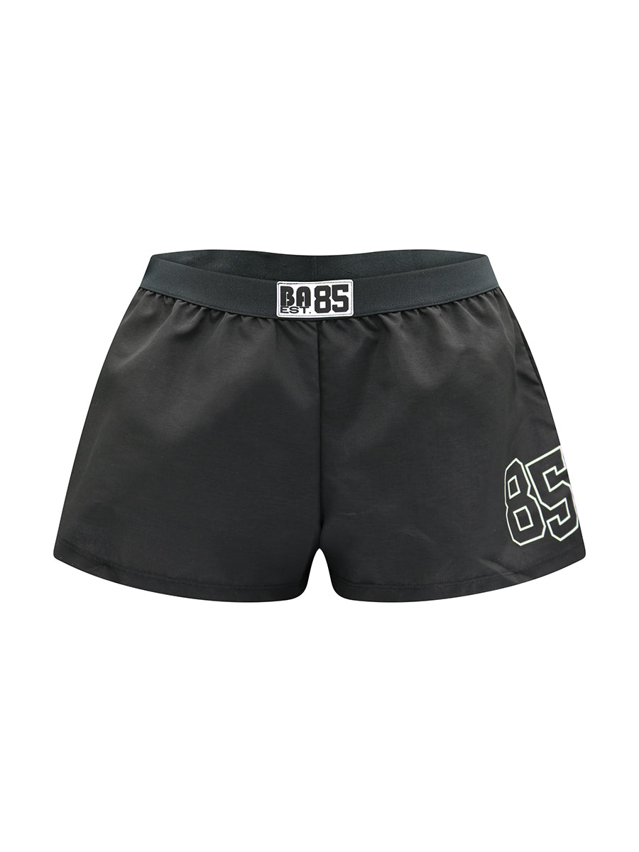 Black athletic shorts with white Body Aware branding on a plain background.