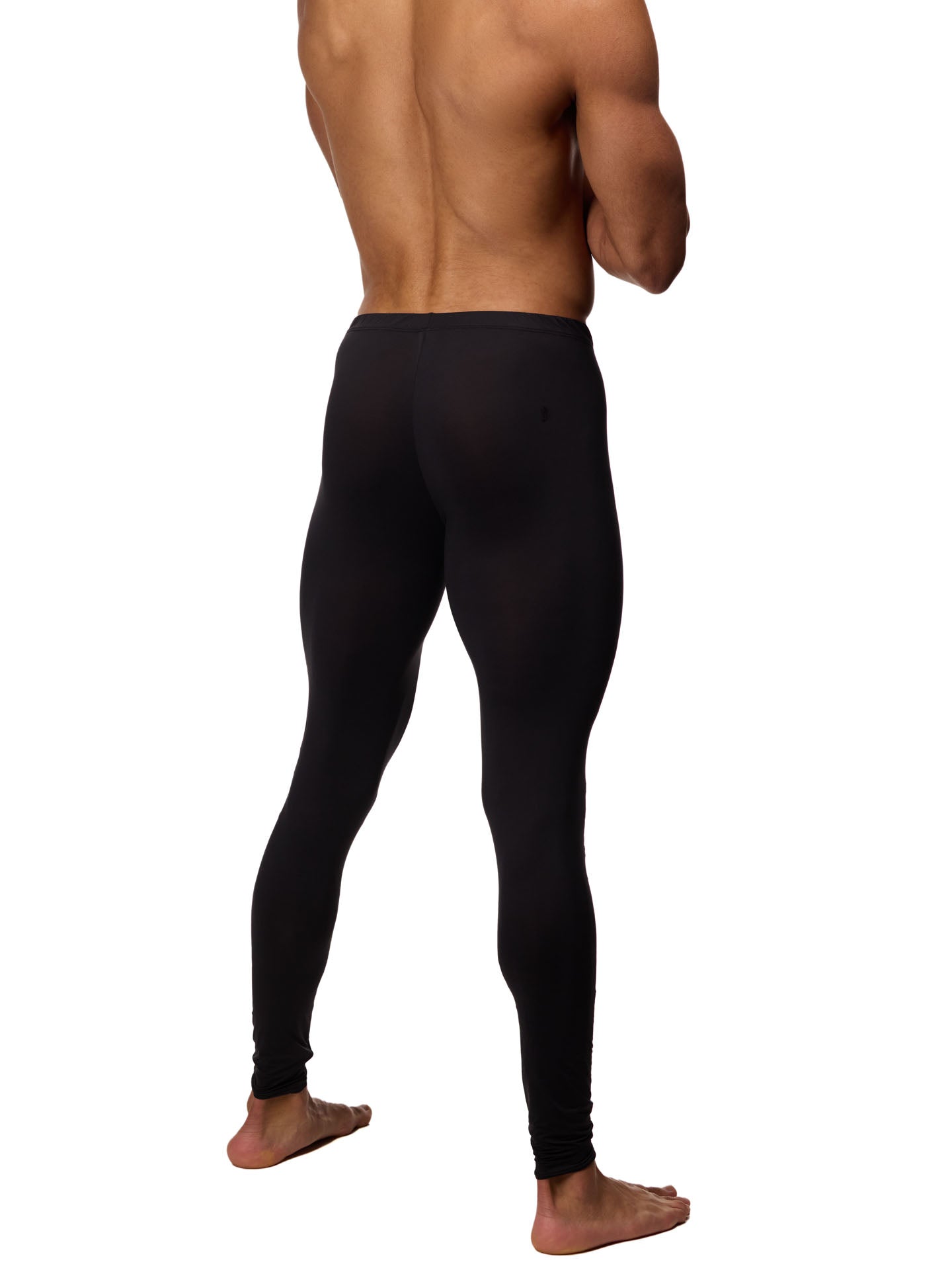 Back side view of a male model wearing black Body Aware leggings