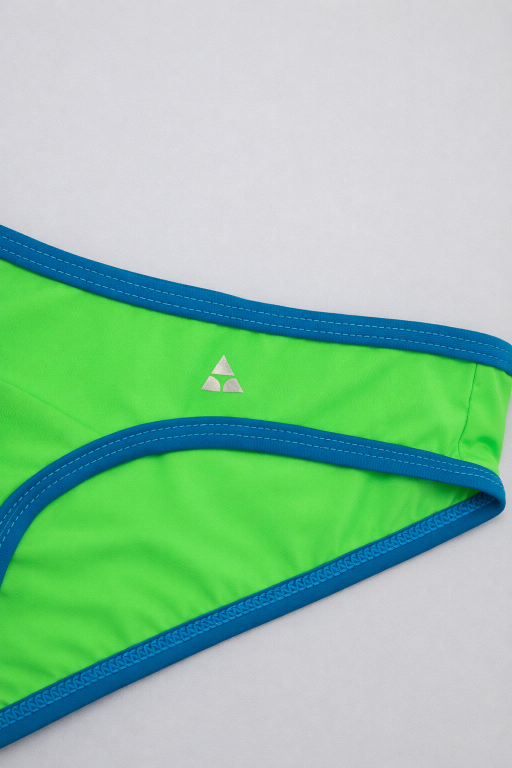 Green underwear with blue trim on a white background