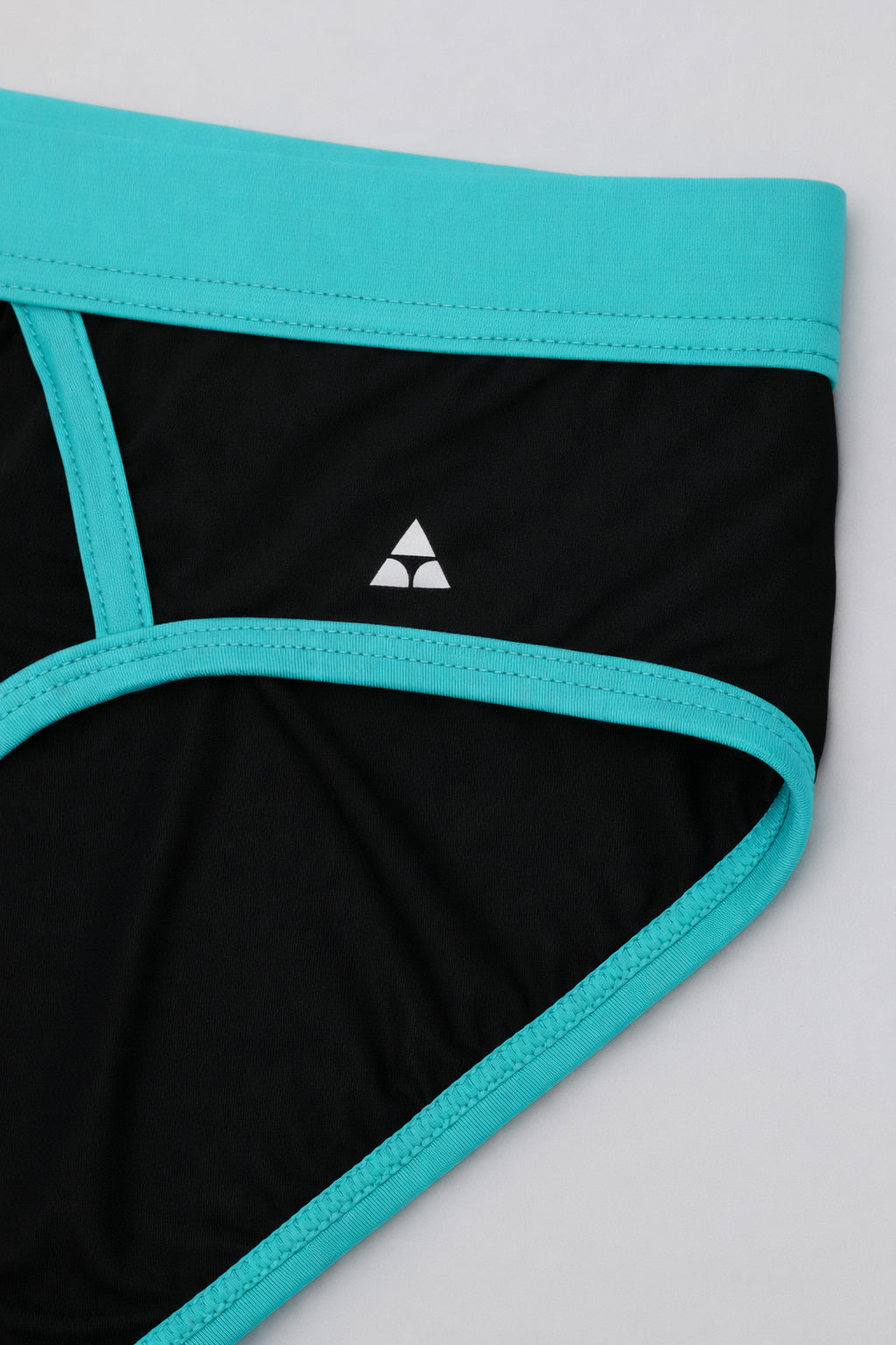 Black men's underwear with teal trim on a white background