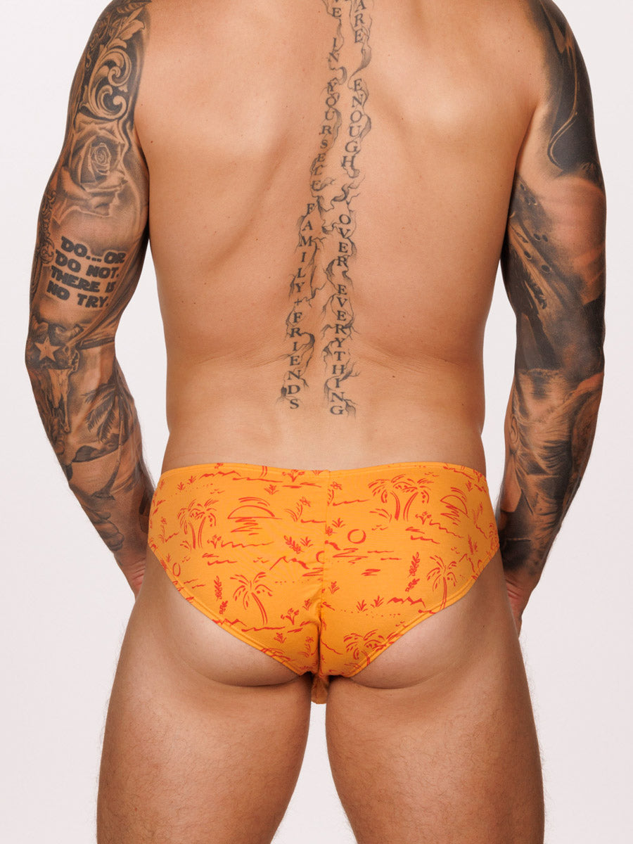 Back view of a male model wearing an orange Body Aware brief