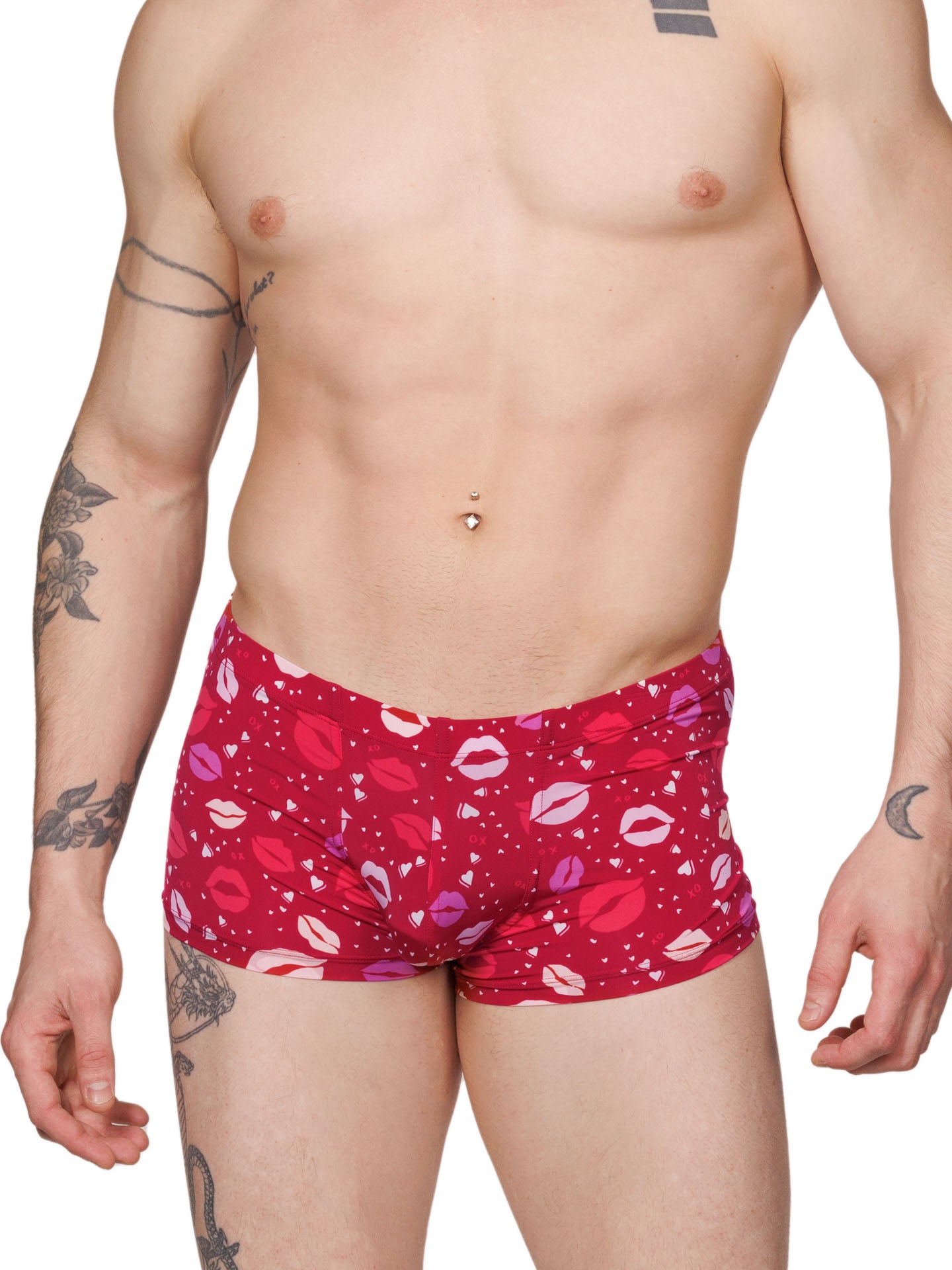 Front view of a male model wearing red Body Aware boxer shorts with a lipstick kiss pattern