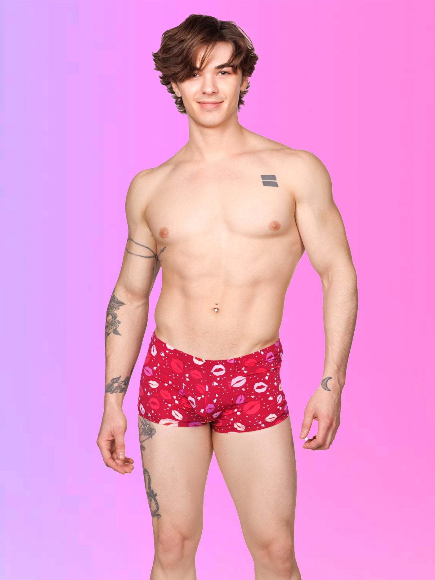 Front view of a male model wearing red Body Aware boxer shorts with a lipstick kiss pattern