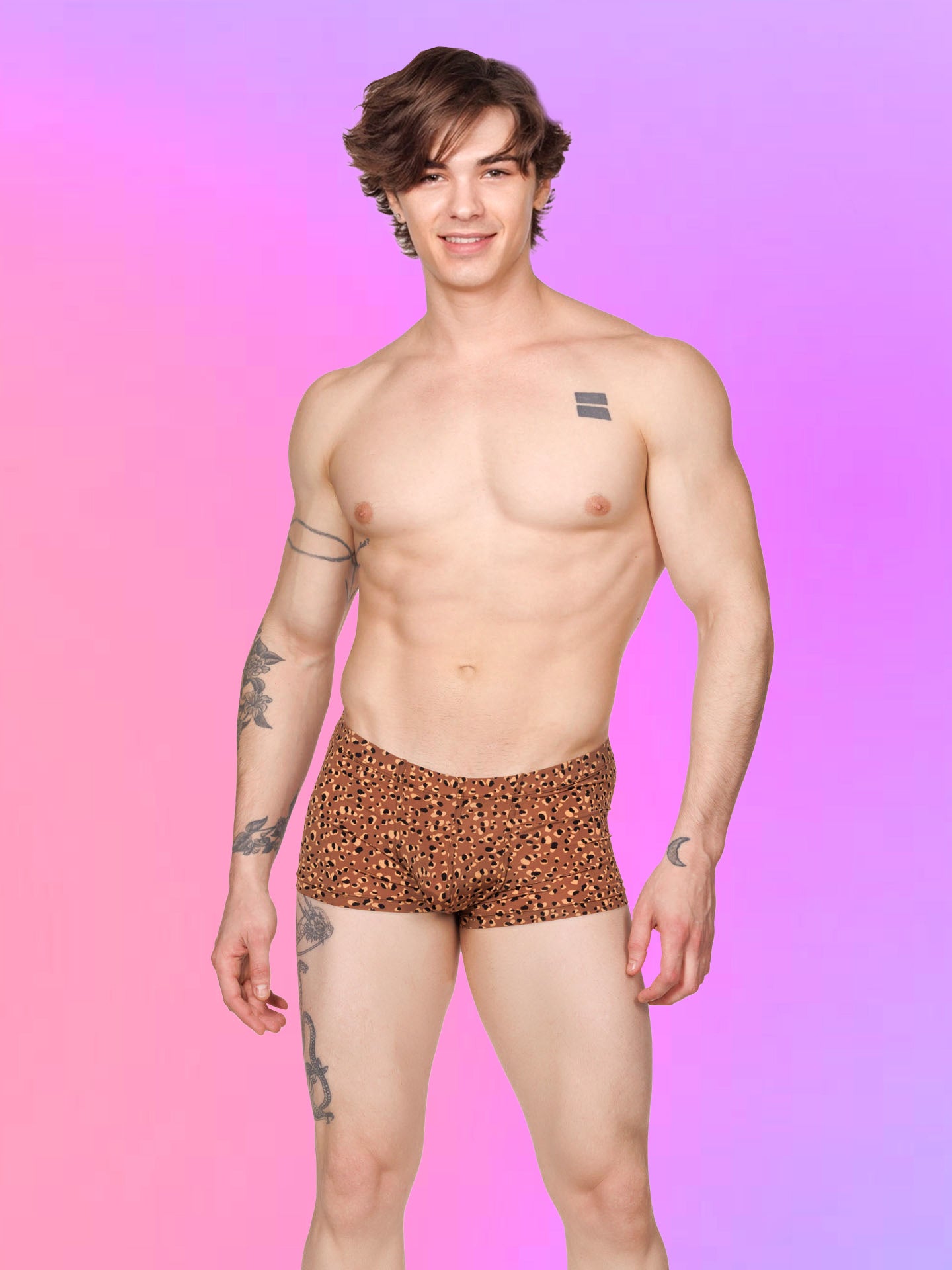 Front view of a male model wearing brown Body Aware boxer shorts with a leopard spot pattern