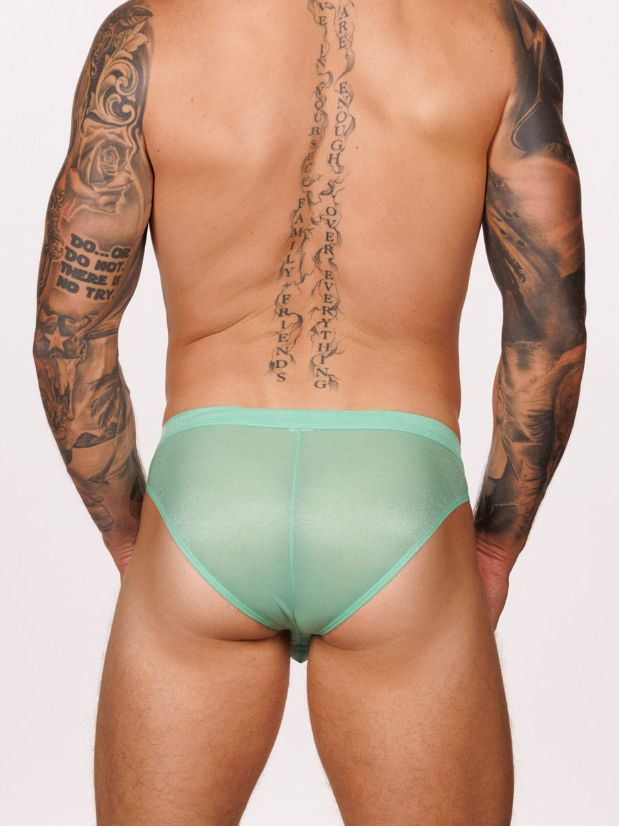 Back view of a male model wearing green Body Aware briefs