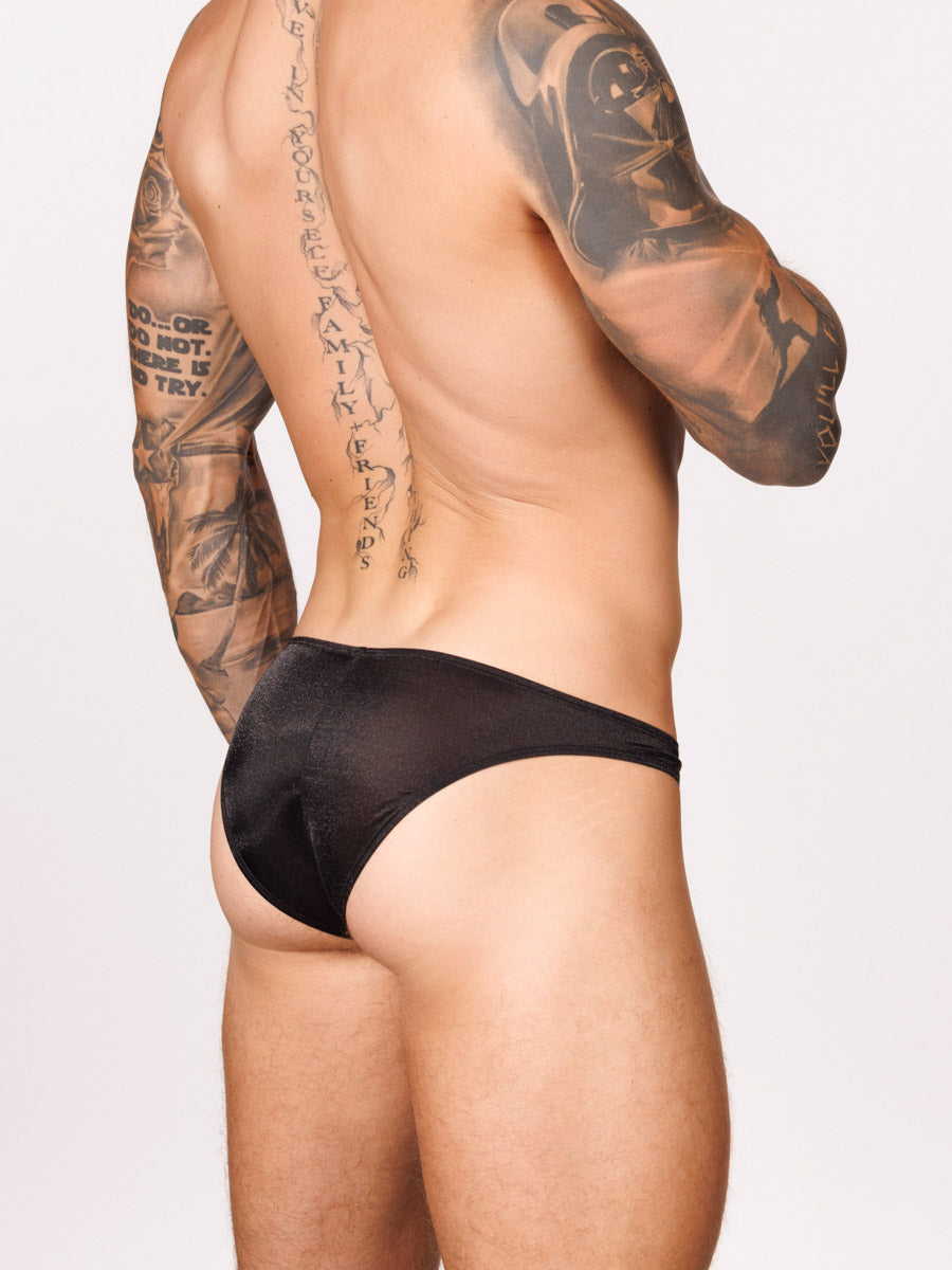 Side view of a male model wearing black Body Aware briefs