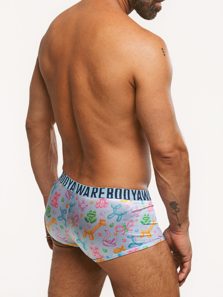 Back view of a man wearing light blue satin boxers with Body Aware branded waistband