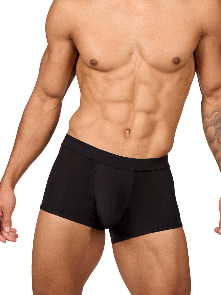 Front view of a muscular male model wearing black Body Aware boxer shorts