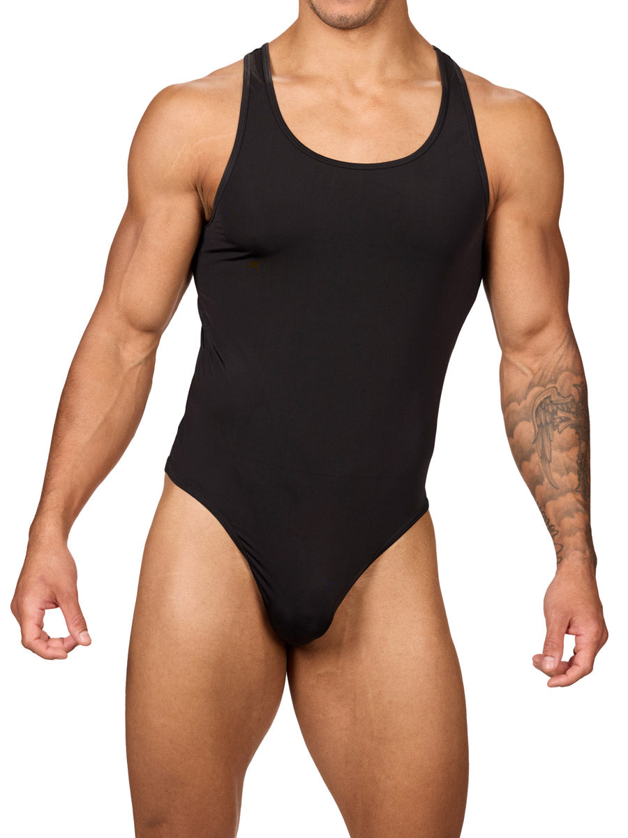 Front view of a muscular male model wearing a black Body Aware thong bodysuit