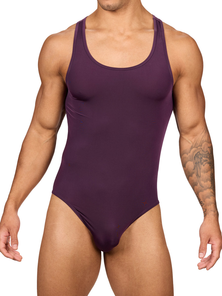 Front view of a muscular male model wearing a purple Body Aware brief bodysuit