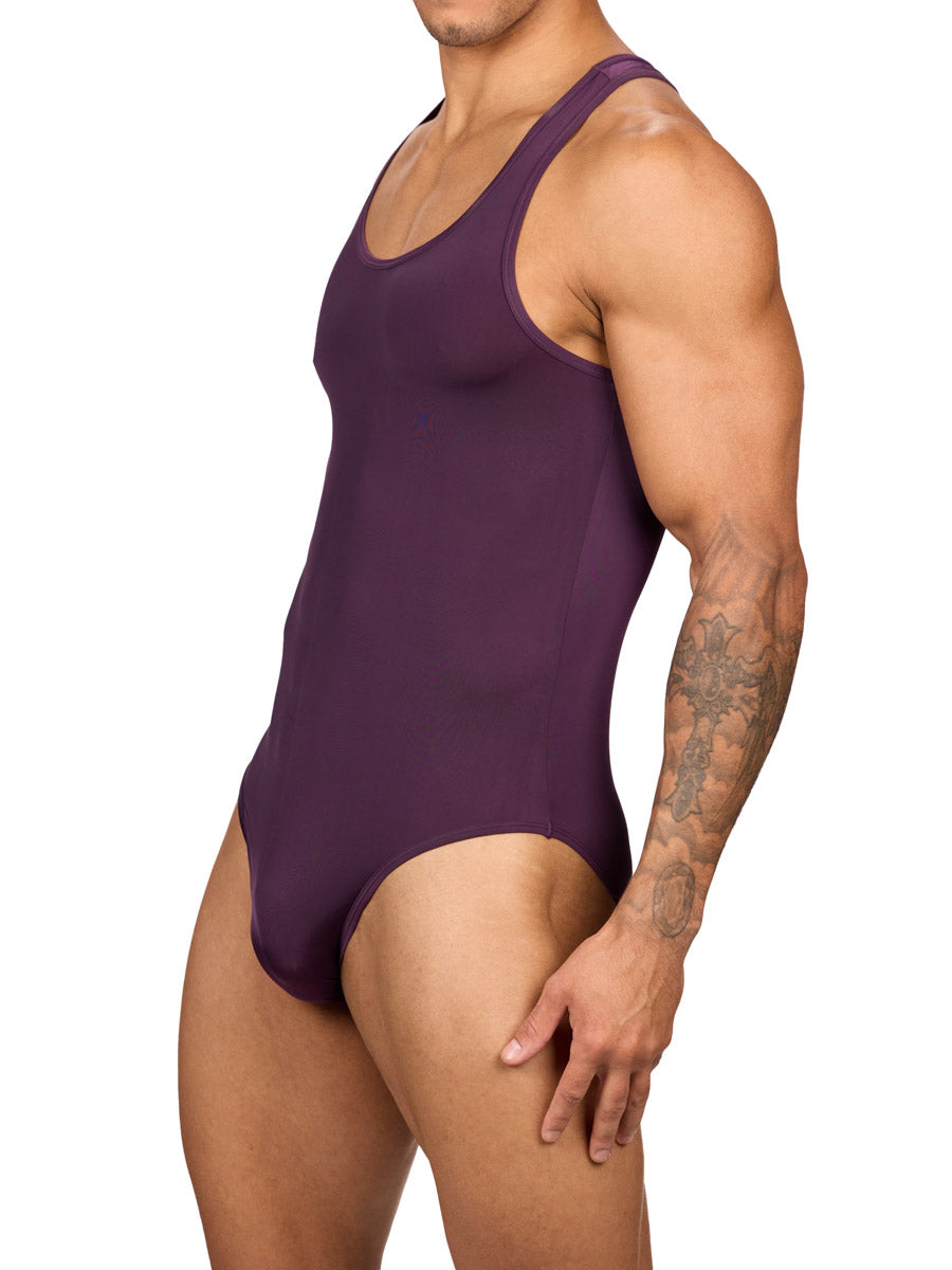 Side view of a muscular male model wearing a purple Body Aware brief bodysuit