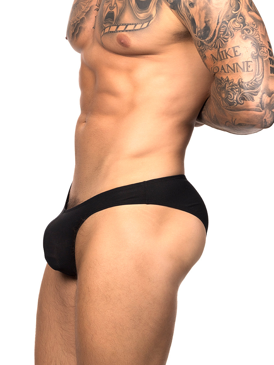 Side view of a male model wearing black Body Aware briefs