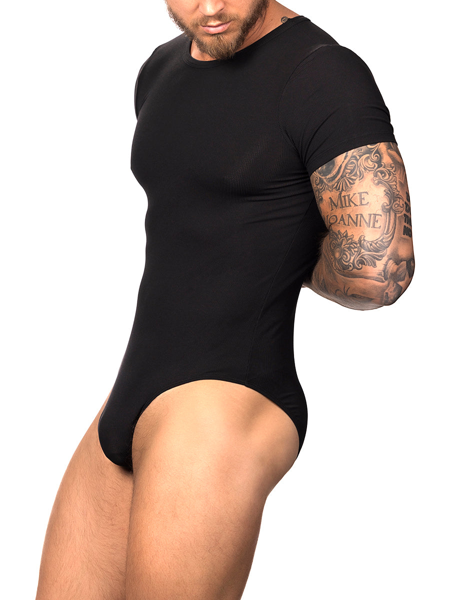 Side view of a male model wearing a black Body Aware t-shirt style bodysuit with brief back