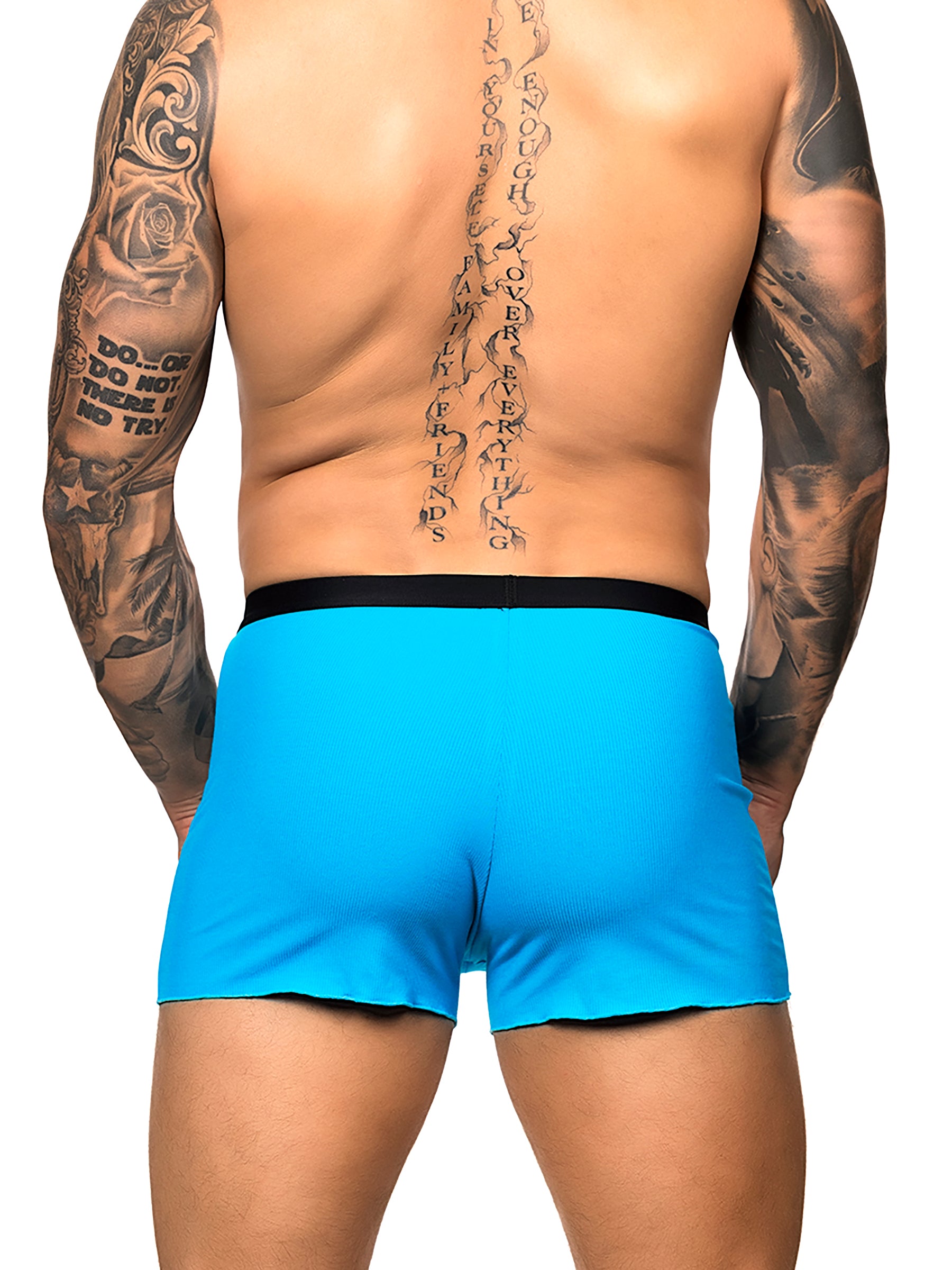 Back view of a male model wearing turquoise Body Aware shorts with black waistband