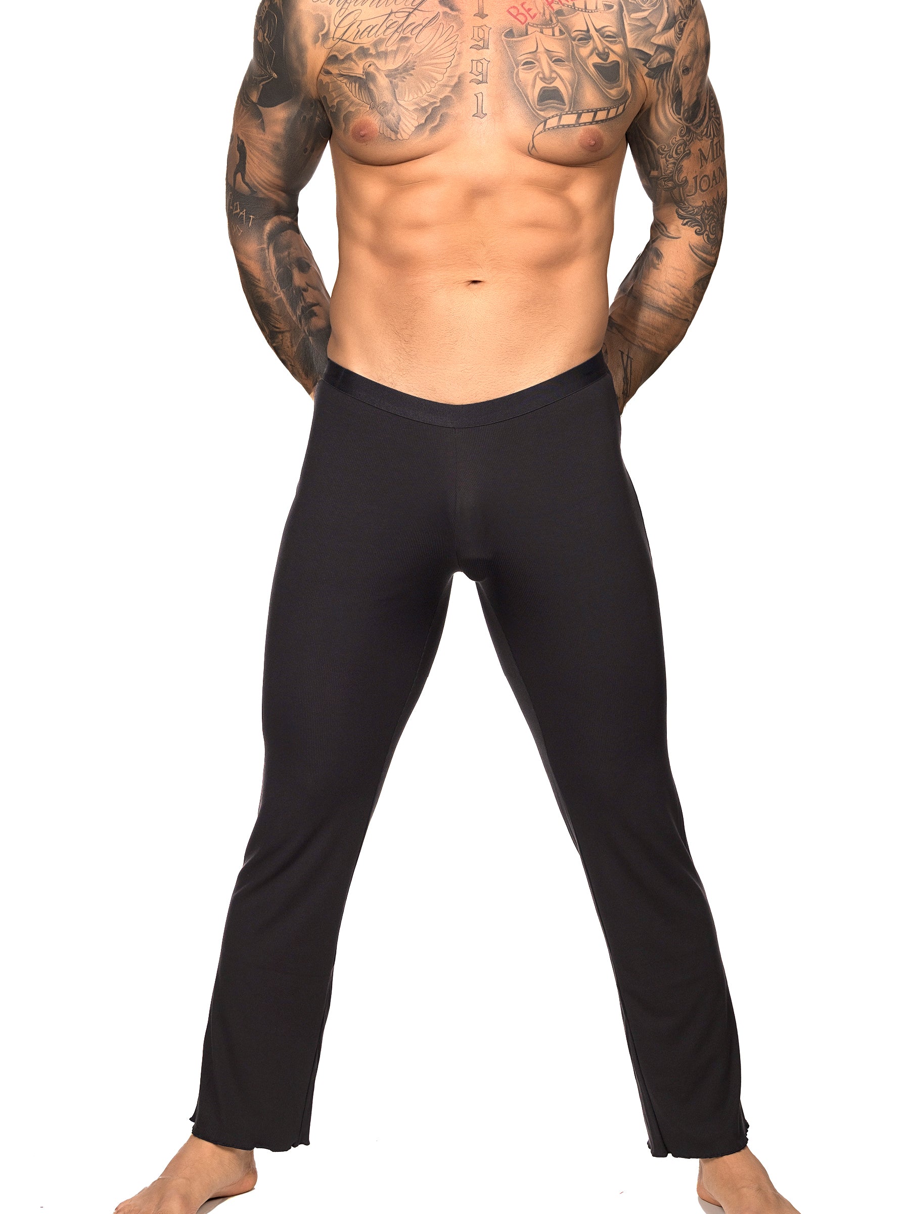 Front view of a male model wearing black Body Aware lounge pants