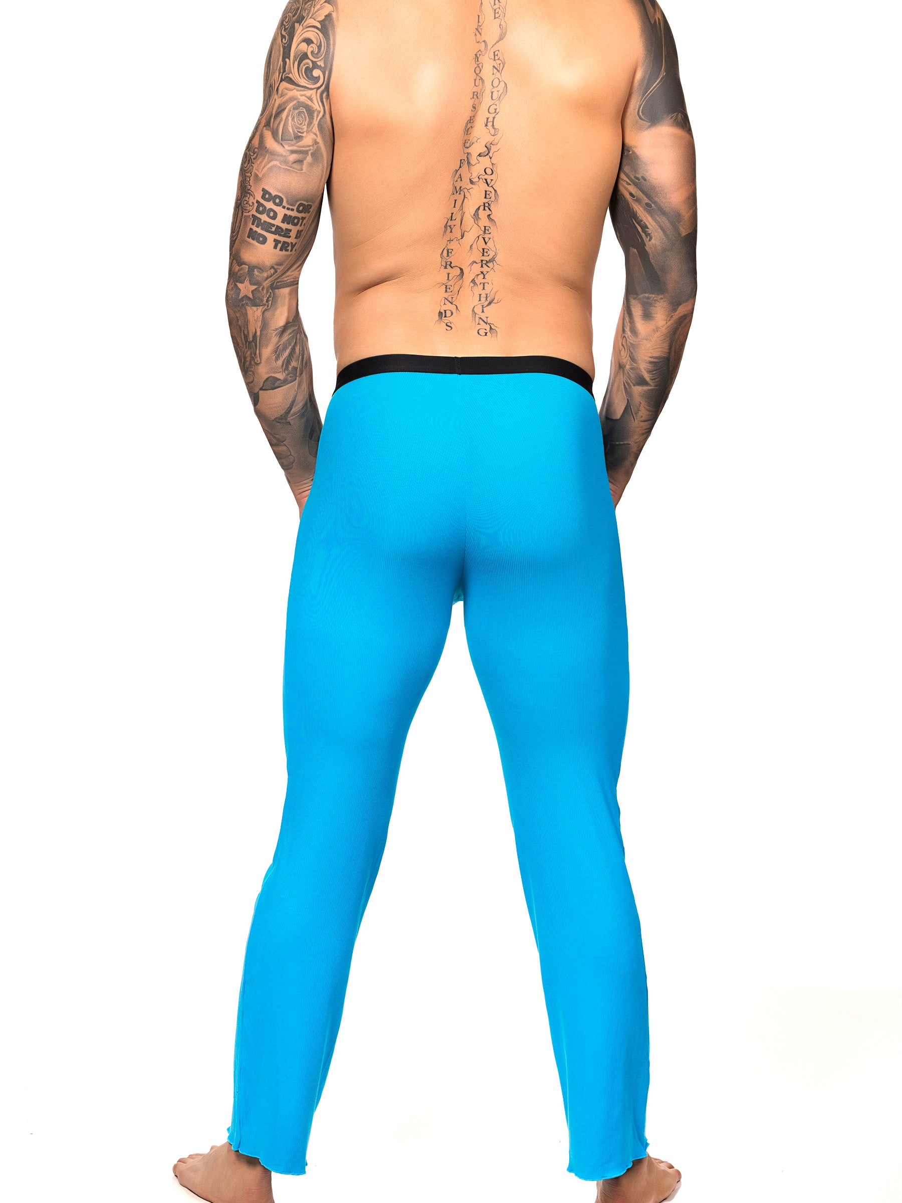 Back view of a male model wearing turquoise Body Aware lounge pants with black waistband