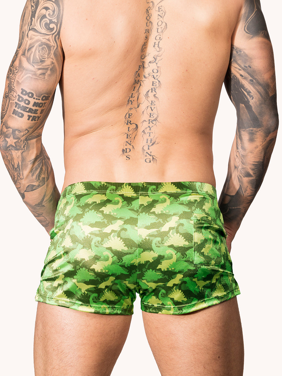 Back view of a male model wearning green Body Aware shorts with a camo pattern