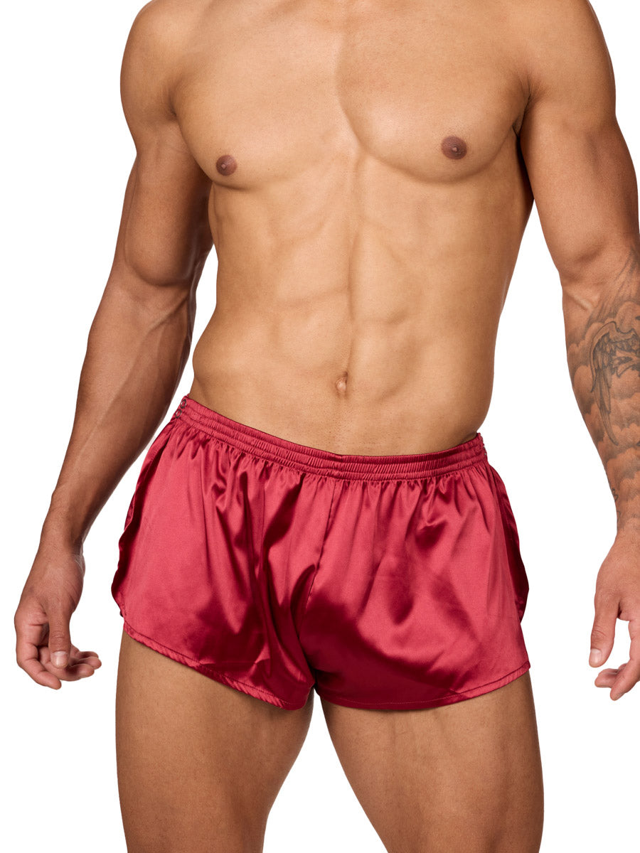 Front view of a male model wearing Body Aware red men's tear away shorts