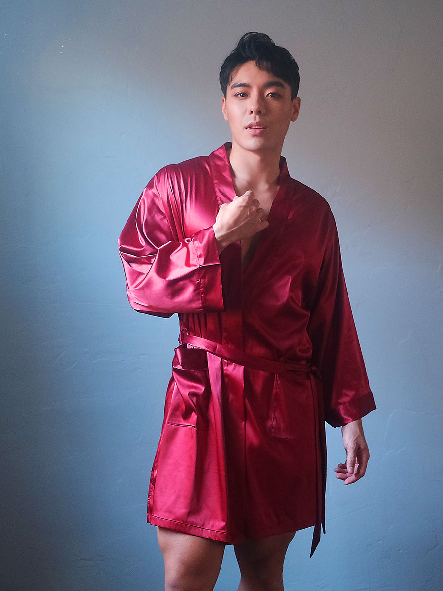 Front view of a male model wearing a red Body Aware men's robe