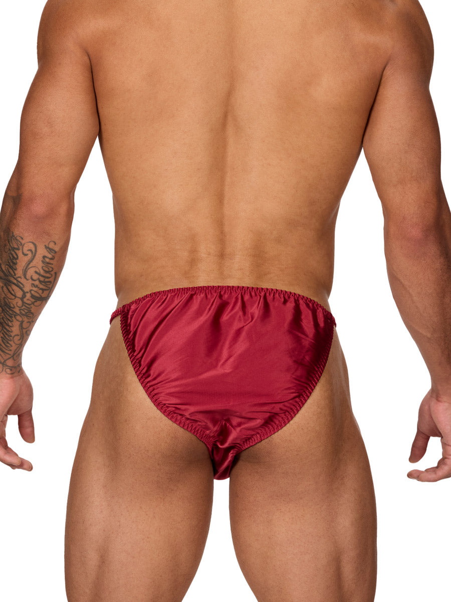 Back view of a male model wearing a Body Aware burgundy bikini brief