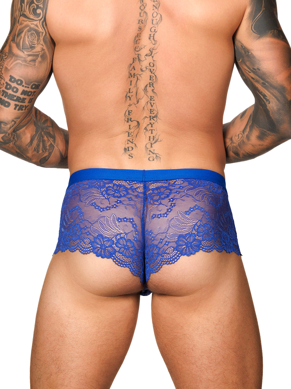 Back view of a male model wearing Body Aware bright blue lace boxers