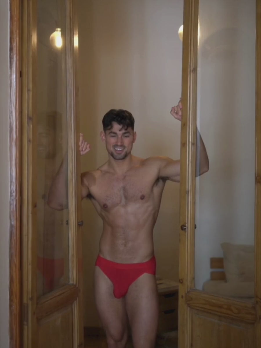 Video of a man wearing red Body Aware briefs.
