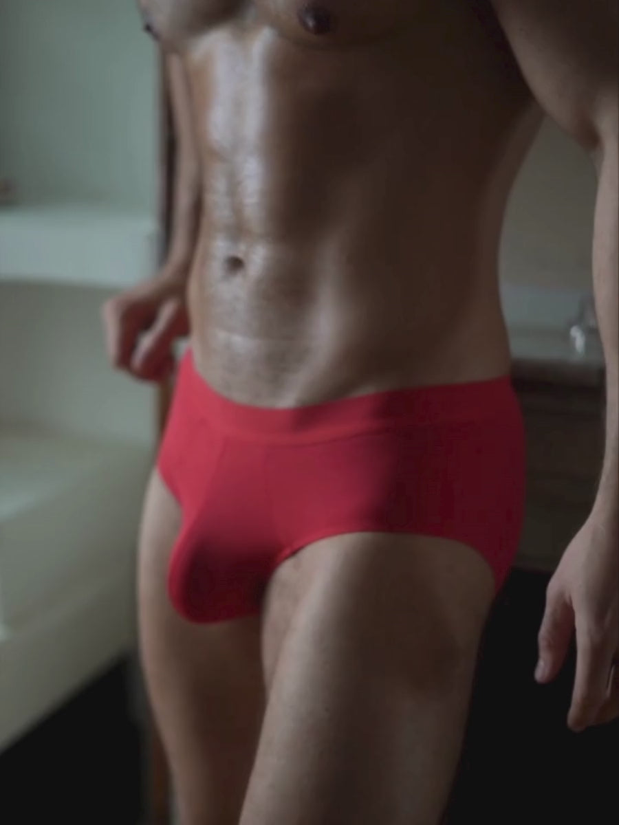 Video of a man wearing red Body Aware briefs.