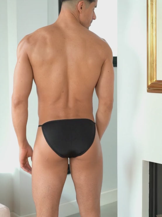 Video of a man wearing a black men's bikini brief.